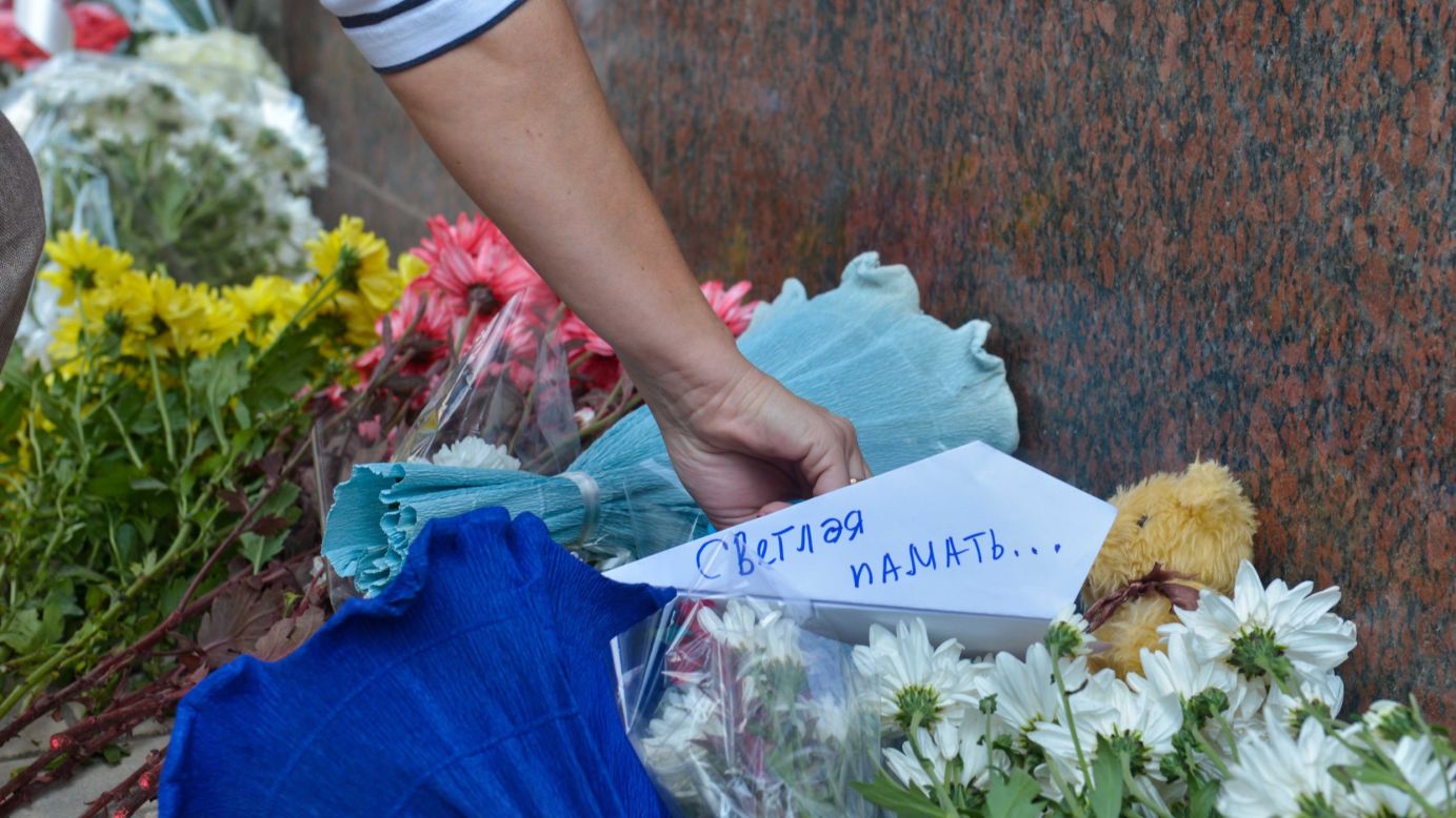 People place flowers and messages in front of the Russian Embassy in Cairo on November 1.  