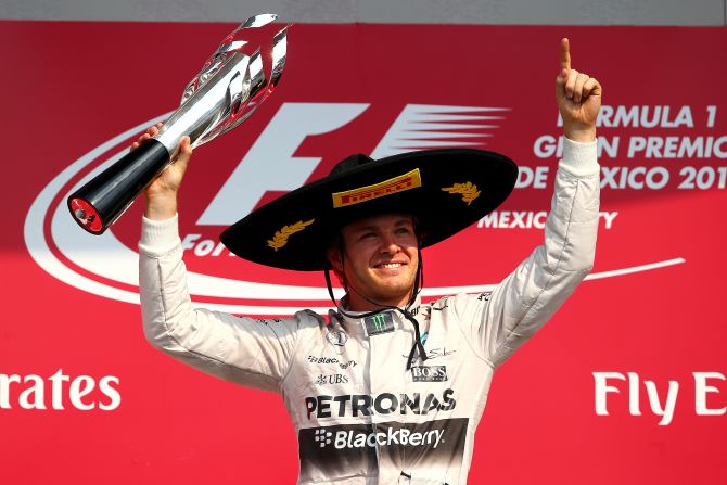 Rosberg celebrates on the podium after winning the Mexico GP at Autodromo Hermanos Rodriguez to move into second in the championship standings with his fourth win of the season.
