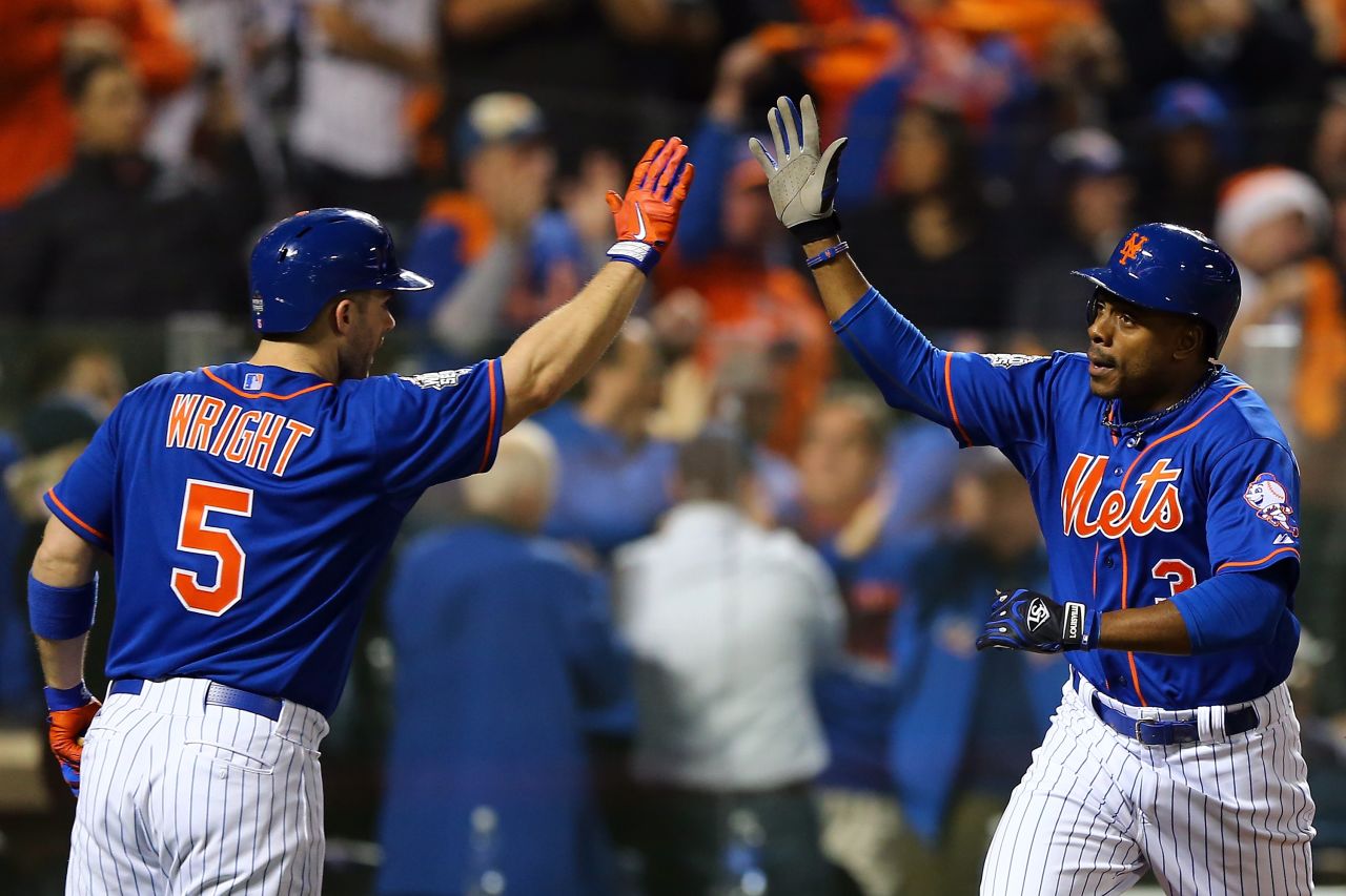 Curtis Granderson of the New York Mets celebrates with David Wright after hitting a solo home run. 