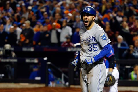 Kansas City Royals' Eric Hosmer celebrates after scoring a run off a grounded-out hit by Salvador Perez to tie the game in the ninth inning.