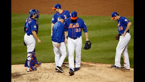 Matt Harvey, the Mets starting pitcher for Game 5, walks off the mound after being relieved in the ninth inning.