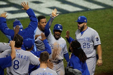 Kansas City's Jarrod Dyson celebrates after scoring the go-ahead run hit by Christian Colon in the 12th inning.