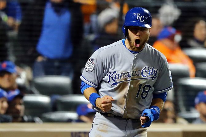 Kansas City's Ben Zobrist celebrates after scoring a run in the 12th inning.