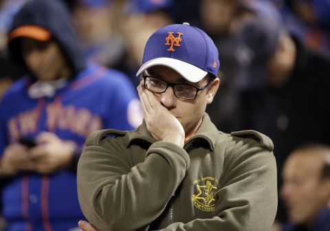 A New York Mets fan reacts during the 12th inning.