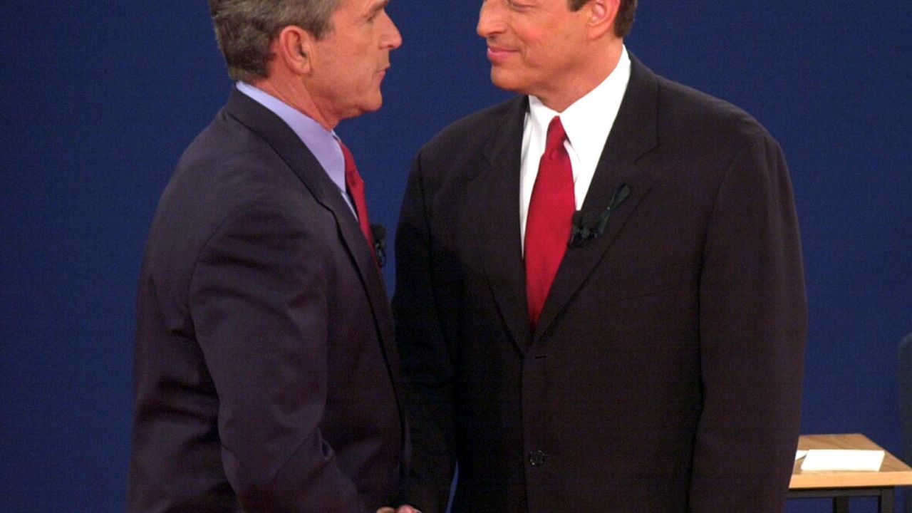 George W. Bush shakes hands with Al Gore after their third debate in October 2000.