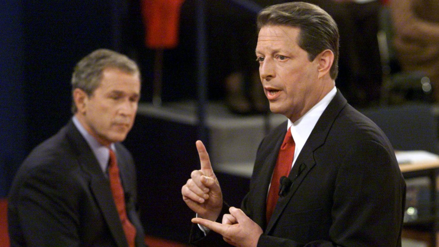 ST. LOUIS:  Democratic presidential nominee Al Gore answers a question as Republican presidential nominee George W. Bush listens during their third debate at Washington University on October 17, 2000. 