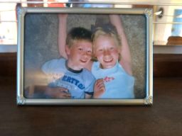 A photograph of John LaDue and his sister, Valerie, rests on the mantle in the family's living room.