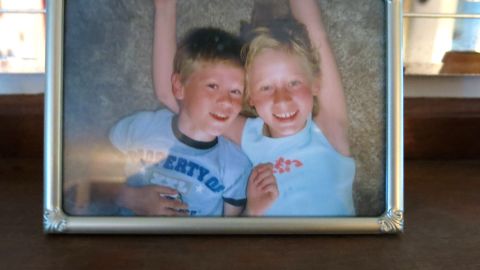 A photograph of John LaDue and his sister, Valerie, rests on the mantle in the family's living room.