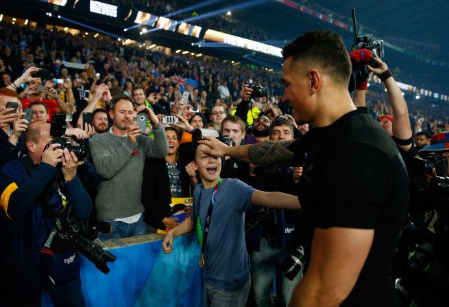 Williams intervened and walked the teenager back to his place in the stands as well as giving him an unforgettable memento.