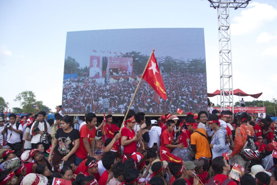 Supporters of Aung San Suu Kyi's opposition party, the National League For Democracy (NLD), are decked in the red of her party.
