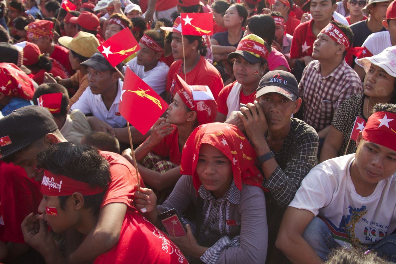 Supporters of the NLD cram the streets in a river of red shirts and flags during the November 1 rally.
