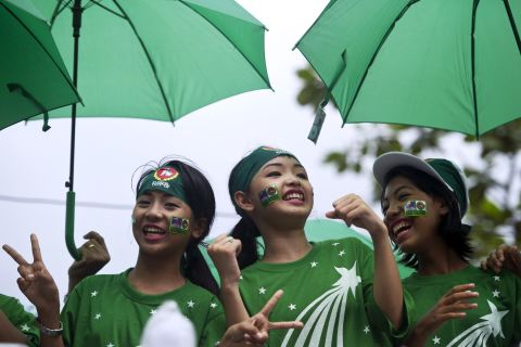Singers perform on a motorcade during a campaign rally by supporters of the army-backed ruling Union Solidarity and Development Party (USDP) in Yangon on October 30.