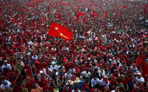Supporters fill the streets in a river of red shirts and flags at a campaign rally for the National League for Democracy in Yangon on November 1.