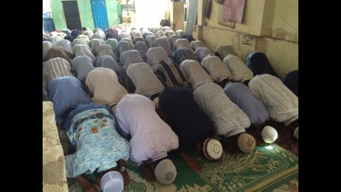 At one of the few mosques still operating in Meiktila, it gets so crowded that people have to pray in shifts at Friday prayers.