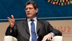 Brazilian Minister of Finance Joaquim Levy, takes part in a debate group moderated by British CNN news presenter Richard Quest, and with the co-participation of IMF Managing Director Christine Lagarde and Mark Carney Governor of the Bank of England (neither in picture), on the subject of Debate on the Global Economy during the World Bank Group and International Monetary Fund (IMF) Annual Meetings in Lima, Peru on October 8, 2015.  AFP PHOTO/CRIS BOURONCLE        (Photo credit should read CRIS BOURONCLE/AFP/Getty Images)