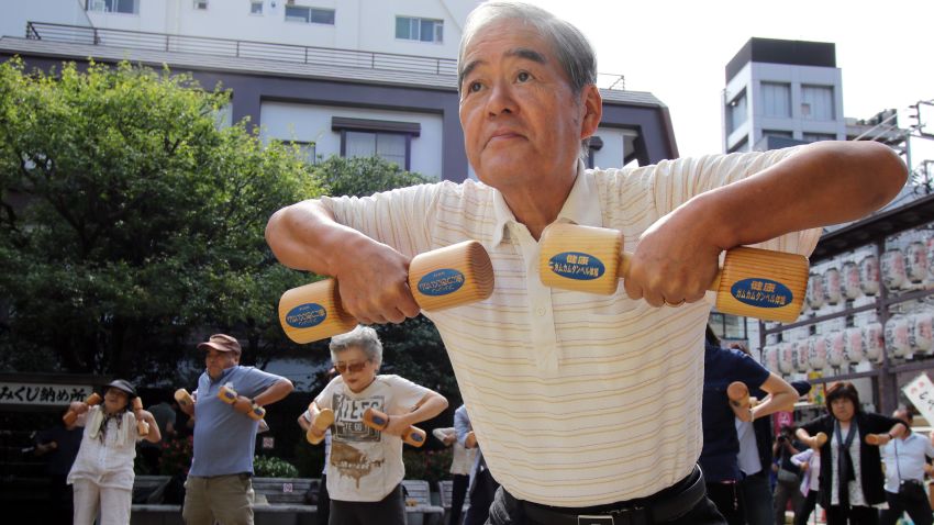 Japan has the longest-living population in the world with people living, on average, to the age of 86. Experts suggest this is due to a combination of good diets, active lifestyles and supportive family structure. Pictured, Elderly people work out with wooden dumb-bells in the grounds of a temple to celebrate Japan's Respect for the Aged Day.