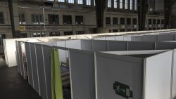 BERLIN, GERMANY - NOVEMBER 02:  Boxes containing beds for migrants are set up at a refugee shelter for migrants inside Hangar 3 at the former Tempelhof Airport on November 2, 2015 in Berlin, Germany. In an effort to accommodate newly arrived migrants, the city of Berlin is now using two hangars in the former Tempelhof airport as indoor shelters. Germany is expecting over one million migrants this year and the city of Berlin alone will receive at least 50,000.  (Photo by Carsten Koall/Getty Images)