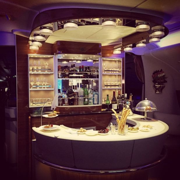 "Credit card reward schemes, millage running, airlines selling miles at a discount -- these are things that anyone can do to travel in premium comfort at a huge discount," said Schlappig, who is not adverse to cocktails on an Emirates first class bar (pictured).<br /><br />"So you're basically paying economy prices for traveling first class."