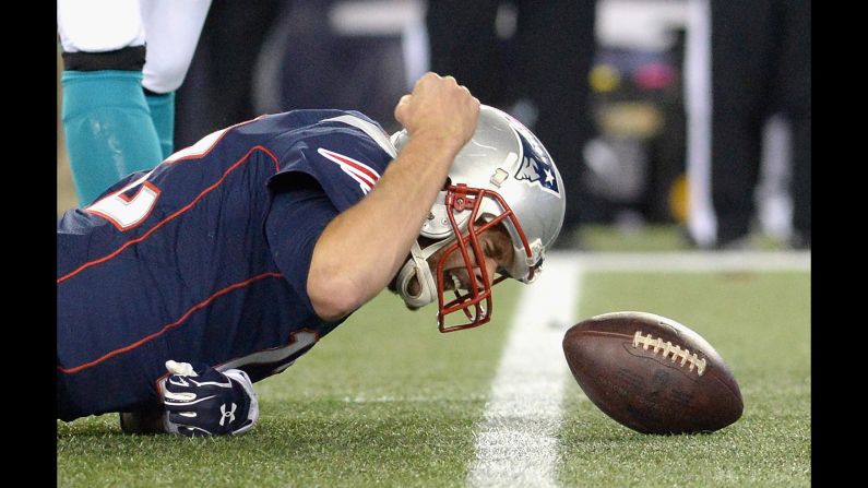 New England Patriots quarterback Tom Brady pounds the turf after a play against Miami on Thursday, October 29. It all worked out for him in the end, however, as the Patriots won 36-7 to stay undefeated this season.
