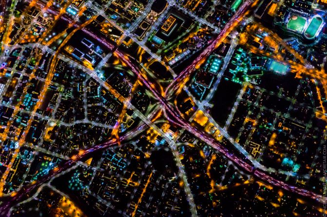 A series of busy highways, lit up by tiny vehicle lights, meet in Los Angeles.