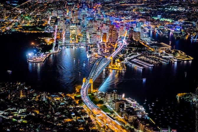 Photographer Vincent Laforet spent the early stages of 2015 edging out of a helicopter door at 12,000 feet to photograph some of the world's biggest cities. Here, Sydney, Australia, glistens at night.