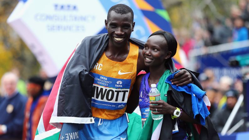 Stanley Biwott and Mary Keitany embrace each other Sunday, November 1, after winning the pro divisions of the <a href="index.php?page=&url=http%3A%2F%2Fwww.cnn.com%2F2015%2F11%2F01%2Fworld%2Fgallery%2Fnew-york-city-marathon-2015%2F" target="_blank">New York City Marathon.</a> Both runners are from Kenya.
