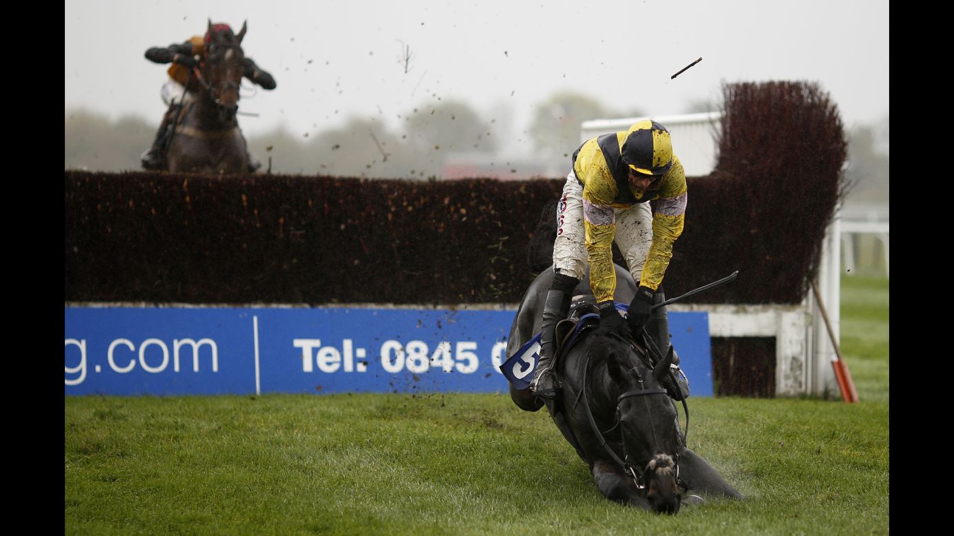 Harry Skelton and his horse, What A Good Night, fall during a steeplechase race in Stratford, England, on Thursday, October 29.