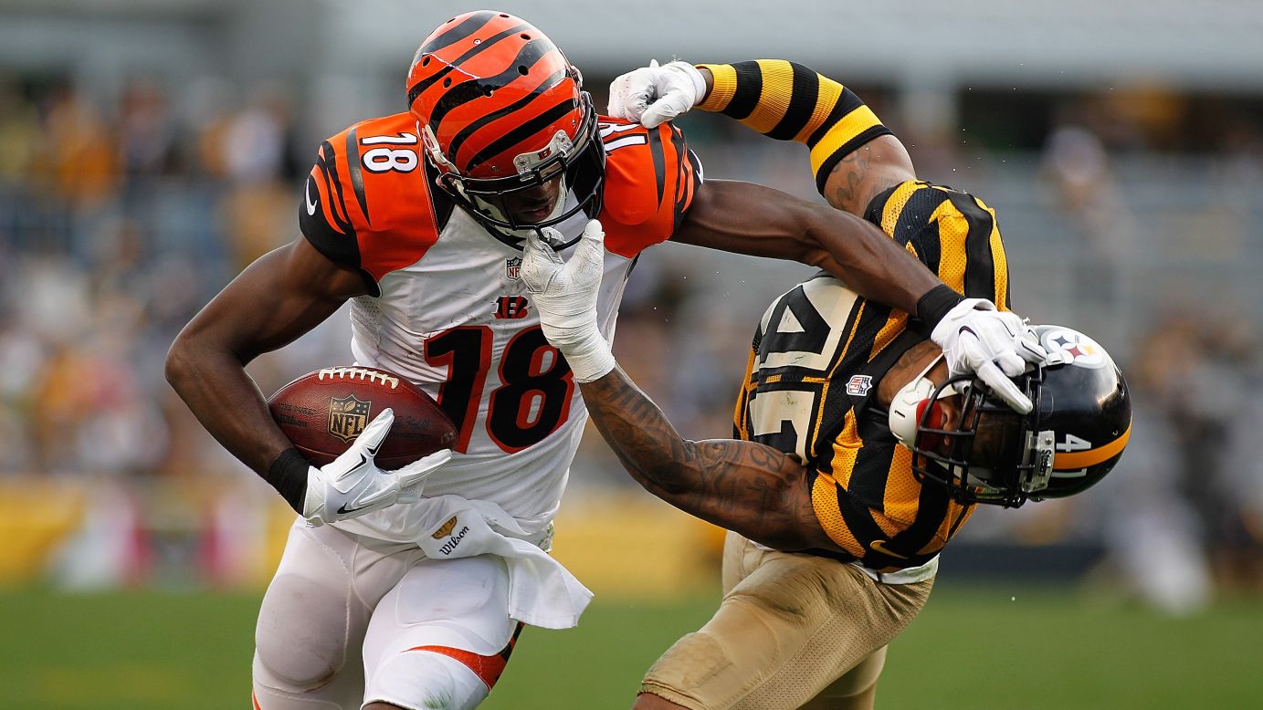 Cincinnati wide receiver A.J. Green stiff-arms Pittsburgh's Antwon Blake during an NFL game in Pittsburgh on Sunday, November 1. Both players were called for face-mask penalties.