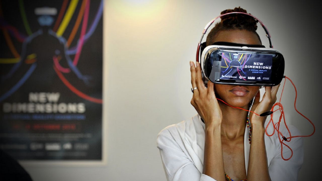 A woman tries a virtual reality headset at the African Futures Exhibition at the Goethe-Institut, Johannesburg.