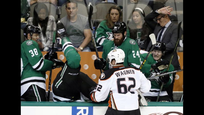 Anaheim's Chris Wagner knocks Dallas' Jamie Oleksiak into his bench during an NHL game in Dallas on Tuesday, October 27.