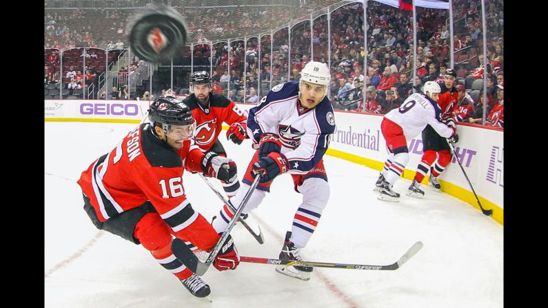 New Jersey's Jacob Josefson, left, and Columbus' Rene Bourque battle for the puck during an NHL game in Newark, New Jersey, on Tuesday, October 27.