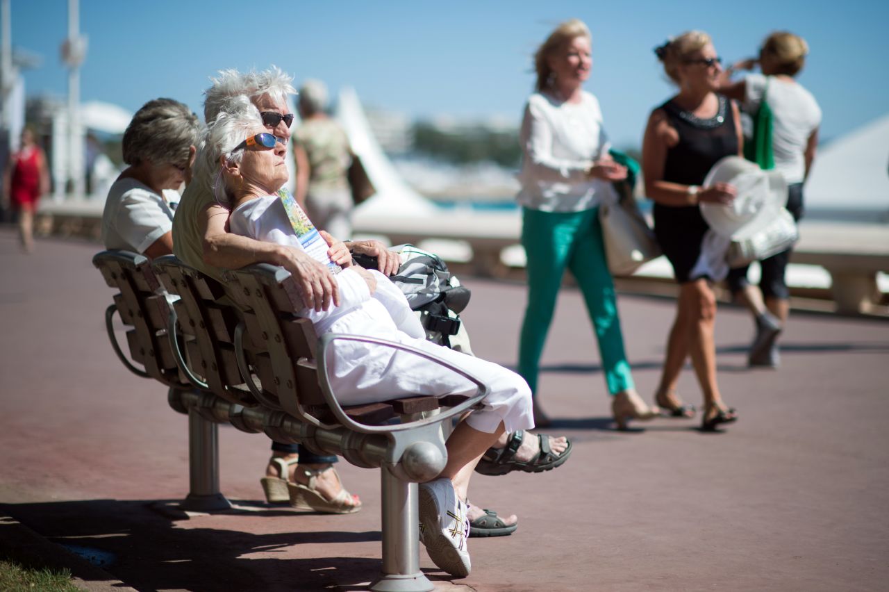 France also tied second with the other countries in southern Europe with, those over 60 living to the age of 85, on average. Pictured, a couple sit on a bench in Cannes.