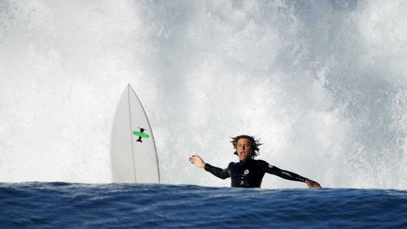 A surfer wipes out while trying to ride a wave in Cardiff, California, on Tuesday, October 27.