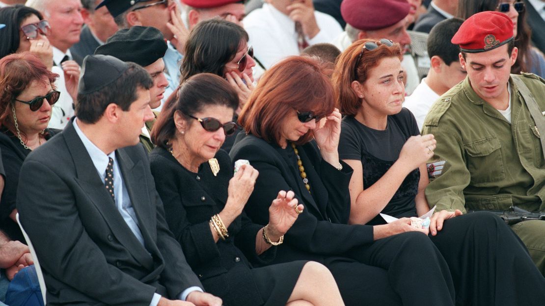 Family members, including widow Leah Rabin, second from left, grieve during the funeral on November 6, 1995, at Jerusalem's Mount Herzl.
