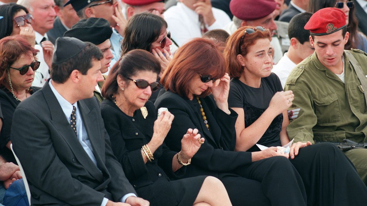 Family members, including widow Leah Rabin, second from left, grieve during the funeral on November 6, 1995, at Jerusalem's Mount Herzl.