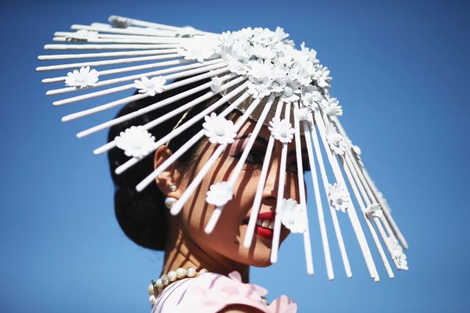 A racegoer arrives on Melbourne Cup Day at Flemington Racecourse on November 3 in sunny Melbourne.