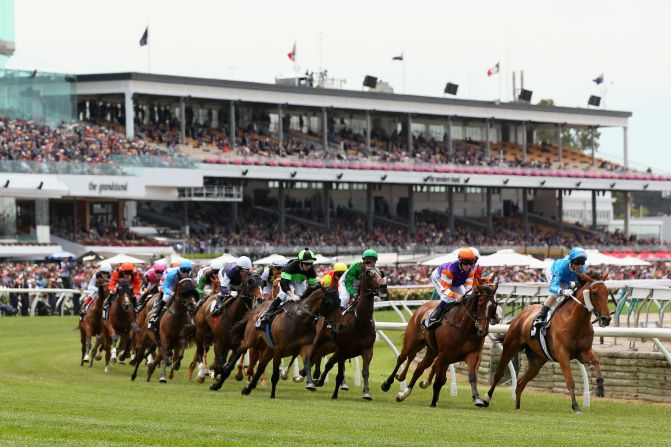 Glen Boss riding Genuine Lad leads the field around the first bend during Race 3 on November 3.