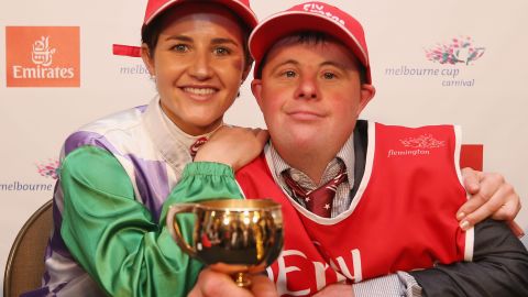Payne with her brother and strapper Steven Payne hold up her trophy. 