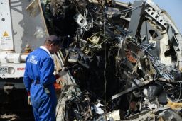 Russian and Egyptian personnel inspect the wreckage of Metrojet Flight 9268 in Sharm el-Sheikh.