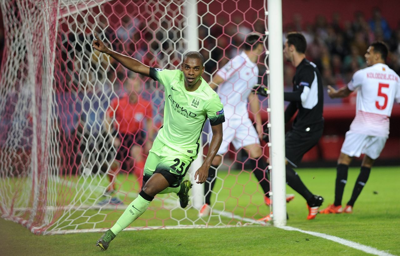 Manchester City qualified for the knockout stage, winning 3-1 at Sevilla. Brazilian midfielder Fernandinho celebrates after scoring the English team's second goal, having set up the opener for Raheem Sterling. 
