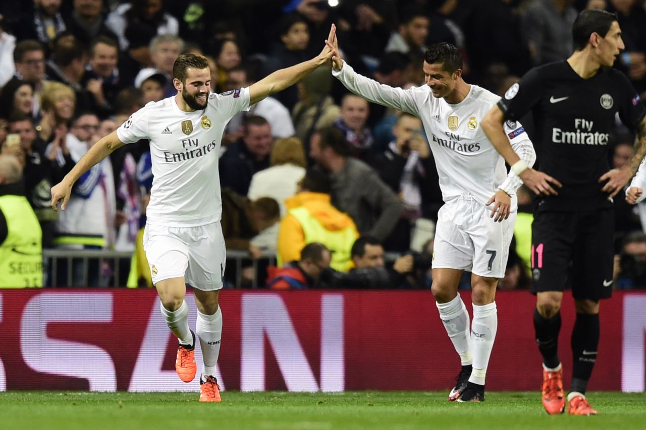 Nacho Fernandez (left) celebrates with Cristiano Ronaldo after the substitute defender's goal gives Real Madrid a 1-0 win over Paris Saint-Germain, putting the Spanish team into the last 16 of the European Champions League. 