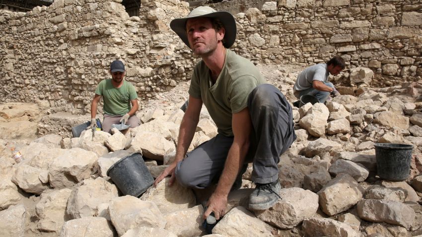 Workers from the Israeli Antiquity Authorities dig on November 3, 2015 at the excavation site near the City of David adjacent to Jerusalem's Old City walls where researchers believe to have found the remains of the stronghold the Acra, from which the Greek King Antiochus IV was able to control Jerusalem and monitor activity at the holy site known to Jews as the Temple Mount. Israel's antiquities body claimed to have solved "one of Jerusalem's greatest archeological mysteries" by unearthing from under a car park the 2,000-year-old citadel, which archaeologists have puzzled for more than a century over its location.