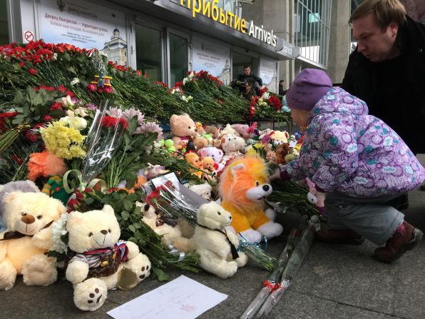 Children came to leave flowers the day after the crash.