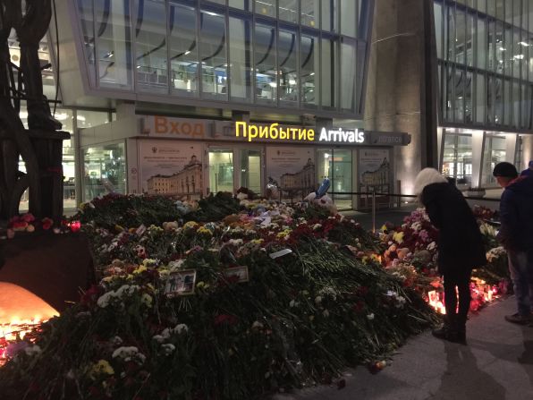 By nightfall a day after the crash, the impromptu memorial was spilling out all along the arrivals entrance to the airport.