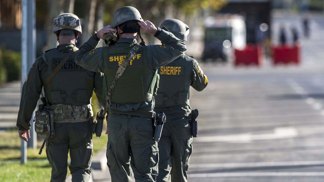 Merced County Sheriff SWAT members enter the University of California, Merced campus after a reported stabbing on Wednesday.