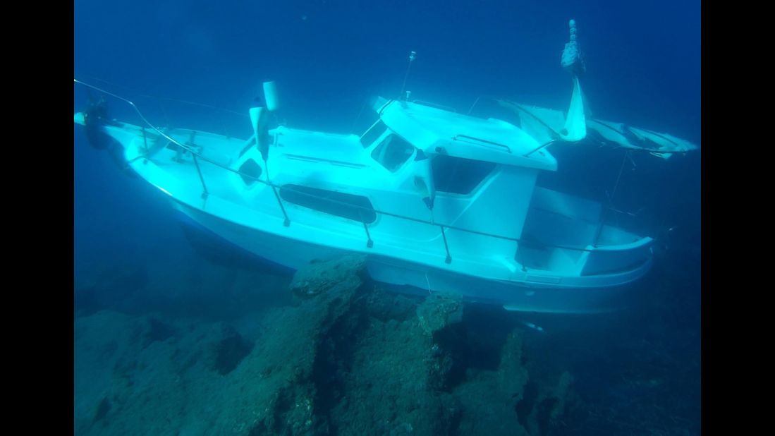 The Kusadasi Ilgun, a sunken 20-foot boat, lies in waters off the Greek island of Samos in November 2016. 