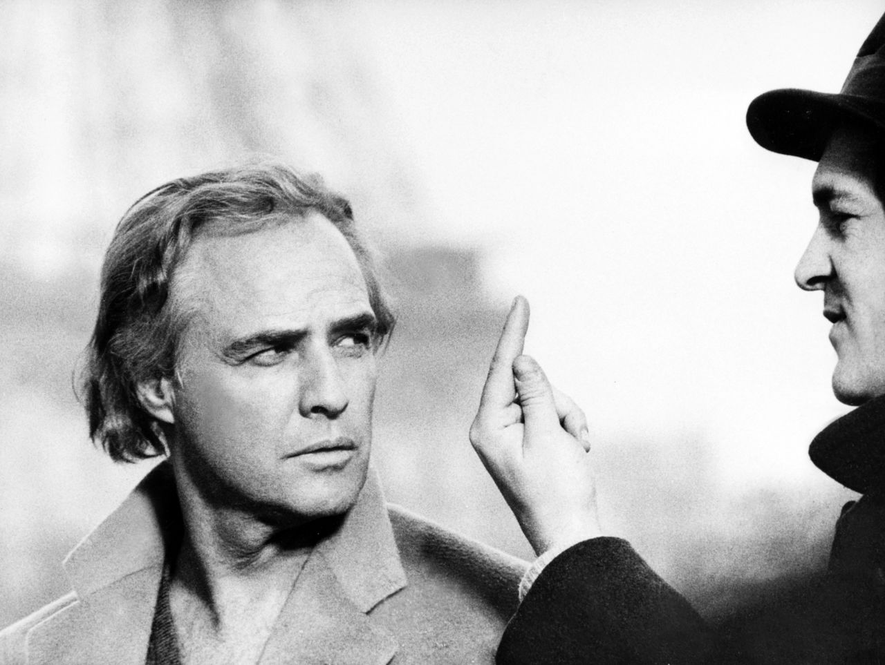 Brando on the set of 'Last Tango in Paris' (1972) with Bernardo Bertolucci. The director drew out a performance from the actor that came uncomfortably close to real life, and led to friction between the two.