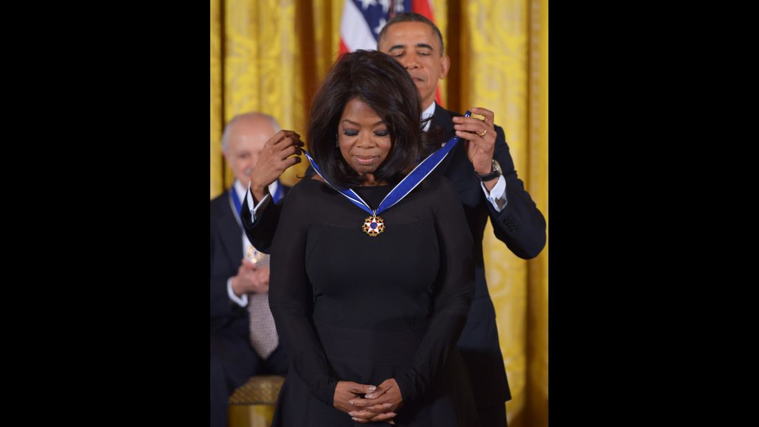 President Barack Obama presents Winfrey with the Presidential Medal of Freedom during a ceremony in the East Room of the White House on November 20, 2013. The Medal of Freedom is the country's foremost civilian honor.