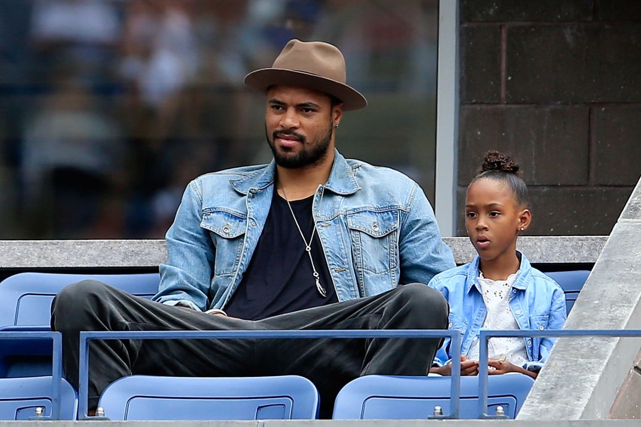 Bosh credits fellow big man Tyson Chandler of the Phoenix Suns for sparking his interest in fashion. Chandler, who is 7-foot 1-inch tall, sits with his daughter Sacha-Marie at the U.S. Open tennis tournament. 