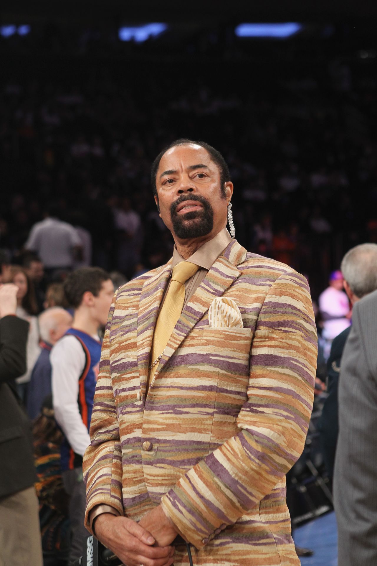 Former New York Knicks legend Walt Frazier sported fur coats and fedora hats as a player, and has kept his sartorial standards high as a sideline announcer.  